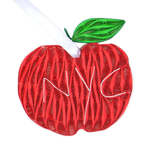 A quilling paper ornament of an apple with the letters "NYC"